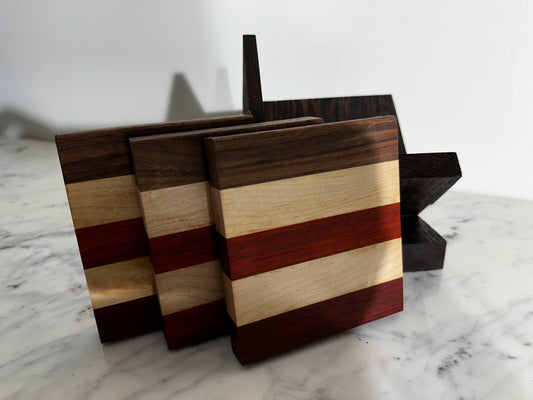 set of 3 Walnut, Paduak and Maple Coasters with modern Wenge Stand